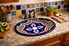 Geometric talavera mexican bathroom sink displayed in a kitchen interior with handcrafted tile and warm finishes