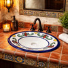 Talavera scroll motif bathroom sink featured in a restaurant restroom with artisan ceramic accents