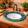 Talavera cobalt green bathroom sink used in a rustic kitchen interior with handcrafted ceramic accents