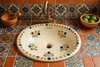 Mexican talavera floral garland sink installed in a Mexican kitchen showing traditional tile and style