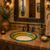 Mexican bathroom sink green vine displayed in a rustic bathroom environment featuring handcrafted elements and natural materials