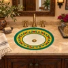 Oval talavera bathroom sink green vine floral design in a hacienda style powder room.