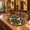 Oval talavera bathroom sink navy yellow floral medallion in Spanish Revival bathroom.