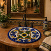 Talavera bathroom sink blue green colonial displayed in a rustic hacienda-style bathroom.