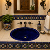 Cobalt blue oval ceramic Mexican sink in a bathroom