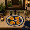 Handcrafted Mexican ceramic sink with cobalt blue artistry featured in a charming guest bathroom vanity.