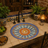 Colorful Mexican bathroom sink with hand painted charm featured in a rustic kitchen bar countertop.
