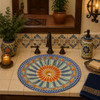 Colorful Mexican bathroom sink with hand painted charm in a Spanish Revival vanity setting.