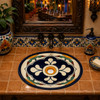 Talavera sink with a hand painted blue medallion design enhancing a Mexican restaurant restroom with authentic handcrafted décor.