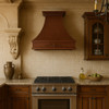 42 inch Old European copper range hood with decorative scroll motif in upscale kitchen, hammered copper canopy with warm patina and elegant handcrafted detailing