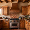 Santa Fe adobe kitchen with custom knotty pine cabinets, terracotta Saltillo tile and concave bell copper range hood, rustic southwestern handmade vent hood