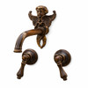 Ornate cherub wall-mounted brass faucet with classic European design defined by sculptural detail and historic character