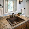 Suburban bathroom with a square drop-in undermount zinc bathroom sink with dark finish