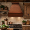 Classic copper range hood - Rustic design in a rustic home kitchen with wood and stone accents