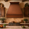 Classic copper range hood - Rustic design in a hacienda kitchen with rustic tile and wood