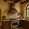 Tapered island 36 inch hammered copper range hood in Tuscan style kitchen