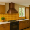 Modern wall-mount pyramid copper range hood in 1970s style kitchen with pastel backsplash tiles