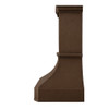 High ceiling island copper range hood side profile view, tall hammered copper canopy with dark rustic patina and tapered silhouette