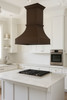 High ceiling island copper range hood in large transitional style kitchen