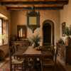 Decorative moorish pendant lamp above a rustic dining room table with handcrafted wood furniture