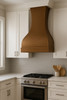 Large custom hammered copper kitchen range hood in contemporary kitchen, dramatic copper feature above sleek cabinetry