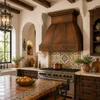Hammered copper range hood in Spanish Colonial kitchen with white plaster, dark wood and colorful tile