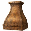 Gothic-style dome copper range hood, angled view with hammered texture, antique patina, straps and rivets