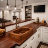 Rectangular copper vessal bar sink with oval bowl in a suburban house  basement setting