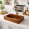 Contemporary kitchen with a rectangular copper vessal bar sink with oval bowl
