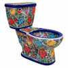 Angled view of a Mexican hand-painted multicolor Talavera floral toilet