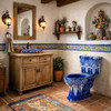 Mexican hand-painted blue and white Talavera toilet in a rustic bathroom with folk art accents