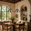 Two rosette punched tin cone pendants with jewels in a Spanish Revival breakfast nook