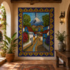 Mexican village volcano tile mural in a Mediterranean hallway with arches and textured plaster walls.