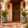 Talavera flower pot with blue, green, orange, yellow design in a hacienda entryway