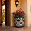 Mexican talavera pot with colorful floral pattern in a traditional hacienda entryway