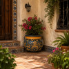 Talavera planter with caramel scrollwork and rolled rim on a sunlit Spanish patio