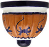 Two Mexican talavera wall sconces with cobalt blue lizard motifs shown on white