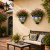 Mexican talavera calla lily wall sconces decorating a colorful Spanish patio