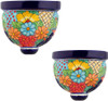 Two Mexican talavera wall sconces with multicolor floral patterns on a white background