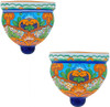 Pair of blue and orange talavera wall sconces shown together on a white background