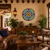 Colorful floral decorative talavera plate with turquoise motif design displayed on a warm hacienda living room wall with rustic furnishings and traditional décor
