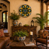 Star medallion decorative talavera plate with yellow scroll design featured above a console in a hacienda living room interior