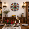 Red floral decorative talavera plate with blue lattice design showcased in an elegant Spanish dining room with classic décor