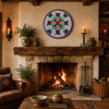 Floral lattice decorative talavera plate with cobalt blue rim displayed showcased above a rustic fireplace with natural materials and charm