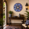 Blue white floral decorative talavera plate with cobalt rim showcased in a colonial entryway with timeless architectural details