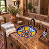 Round talavera bathroom sink yellow blue floral design installed in a rustic wood vanity