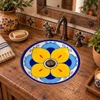 Round talavera bathroom sink with yellow flower design set into a rustic wood vanity