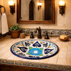 Round talavera bathroom sink blue floral heart design in hacienda bathroom with rustic textures and warm lighting