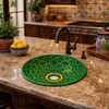 Round talavera bathroom sink green mandala design Mexico in a kitchen island with natural stone and wood cabinetry