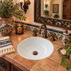 Round white talavera bathroom sink modern ceramic design in a Spanish Revival bathroom